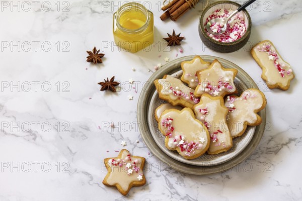 Homemade baking. Gingerbread cookies with glaze on a marble countertop. Copy space