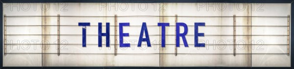 A Grungy Old Weathered Theatre Marquee Sign With Blue Letters