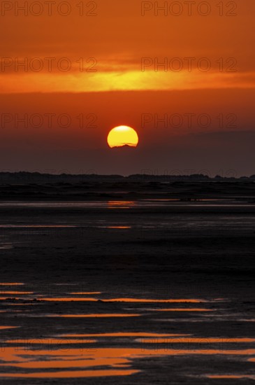 Beautiful golden coloured sunset at the seaside on the Isle Borkum