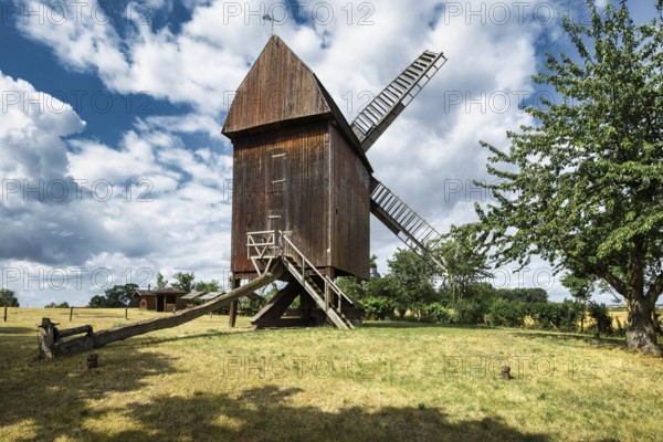 A view of a beautiful windmill in Germany in a natural setting and an eye catcher for tourists
