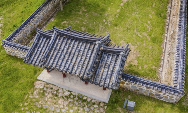Cheongju, South Korea, May 31, 2020: Aerial view of roof top of gate and wall at shrine of independence activist, historian and journalist Chae Ho Sin (1880-1396)