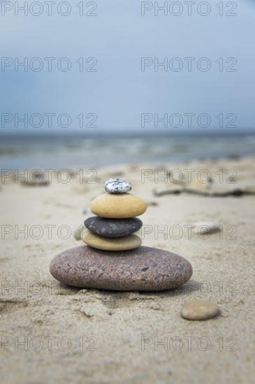 Round pebbles on the beach in Denmark is a symbol for harmony. Stones on the beach in Denmark is a symbol for harmony