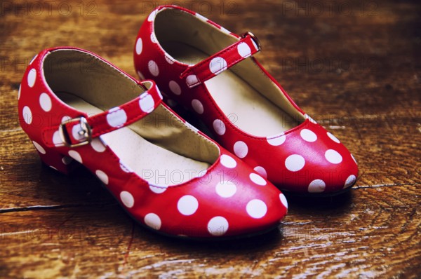 Red dance shoes with white dots