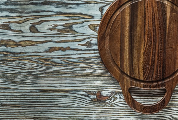 Carving board on vintage wooden surface