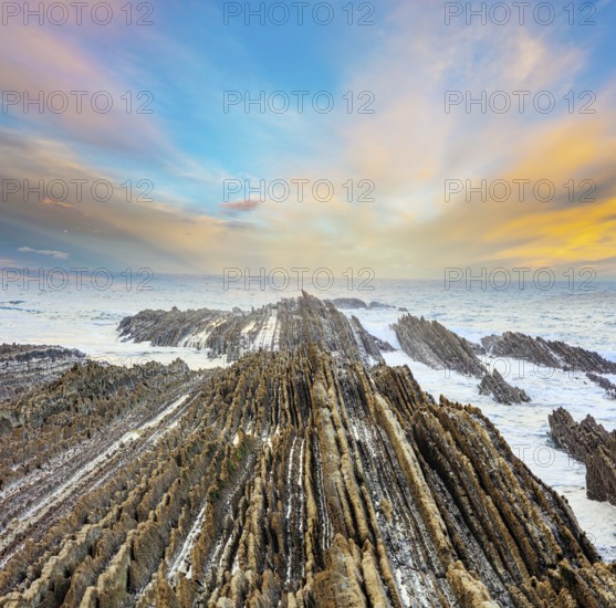 Magical unique landscape. Flysch - unique landscape of underwater rocks exposed at low tide. The most unusual beach in the Basque Country - Itsurun