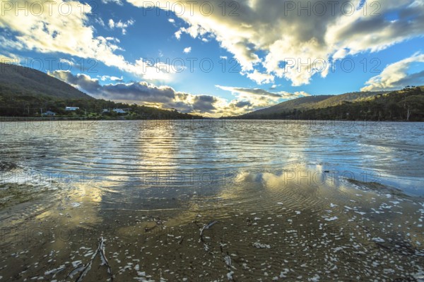 Wild landscapes with clouds reflected in the water, in Tasman Peninsula in South Eastern Tasmania, Australia