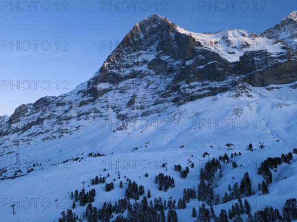 Eiger North Face Mountain at Sunset in Winter. Evening Twilight, Blue Hour. Swiss Alps. Switzerland. Aerial View