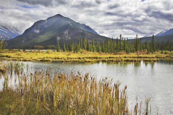 Cold morning on lake in northern mountains in the beginning of autumn