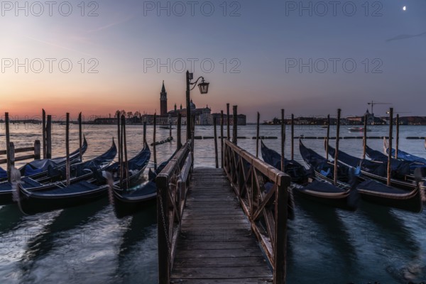 Dawn, Venetian gondolas with the church of San Giorgio Maggiore in the background, Venice, UNESCO World Heritage Site, Veneto, Italy