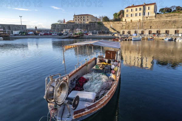 Small traditional fishing boat in Port Tino Rossi, the fishing and pleasure boat harbour near the citadel of Ajaccio, Corsica, France