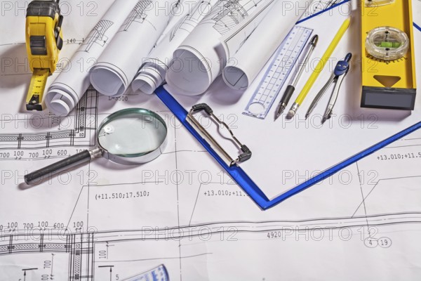 Architect tools on white blueprint construction concept