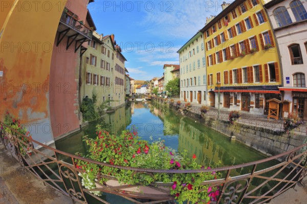 Charming old town of Annecy in Provence. Clear early in the morning. Bridge over the canal is decorated with flowers