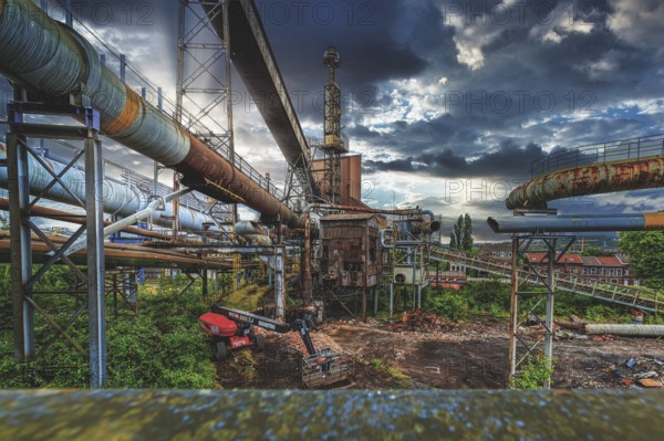 Complex industrial plant with rusted pipes and dilapidated building under a cloudy sky, HF6, Lost Place, Seraing, Province of Liège, Belgium