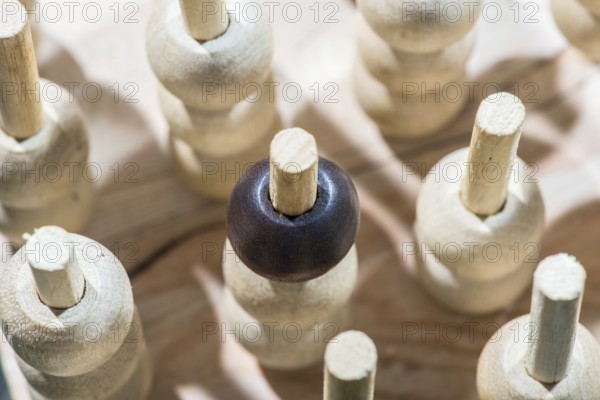 Wooden figures in the concept of individuality and leadership
