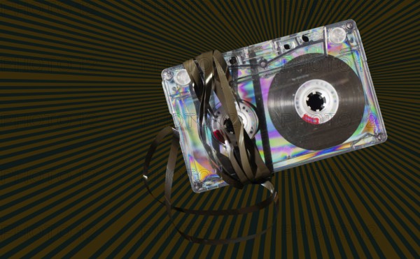 Vintage cassette tape on vintage rays background