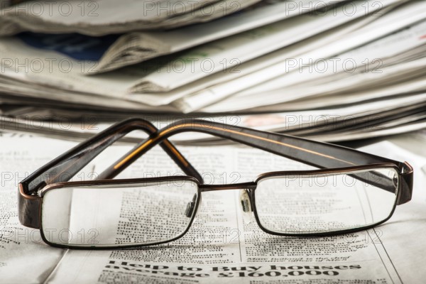 Glasses on newspaper. Natural lightings