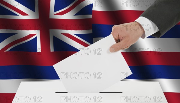 The Hawaii flag and the hand with the bulletin about the ballot box