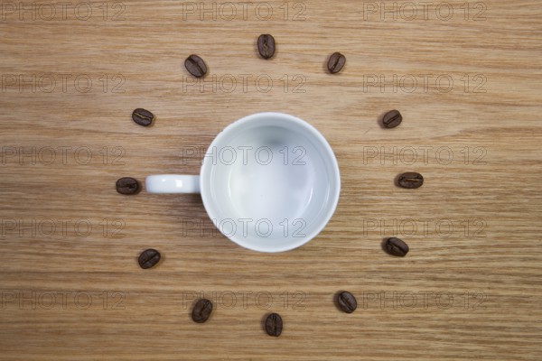 Coffee Time - Empty coffee cup and clock of coffee beans