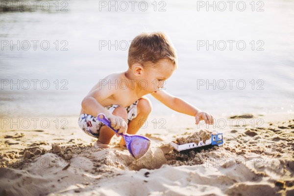 Kids Play On Beach. Sand And Water Toy. Truck toy car with sand and soil. green environment construction equipment at work, construction concept. industrail symbols