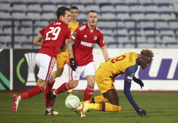 Sofia, Bulgaria - 9 December, 2021: CSKA Sofia's Thomas Lam (L) in action with Roma's Tammy Abraham (R) during the UEFA Europa Conference League group C soccer match between CSKA Sofia and AS Roma
