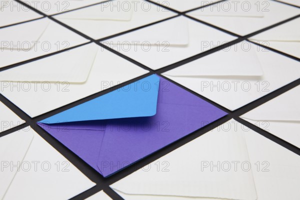 Composition with white and colored envelopes on the table. The photo suitable for various holidays and anniversaries