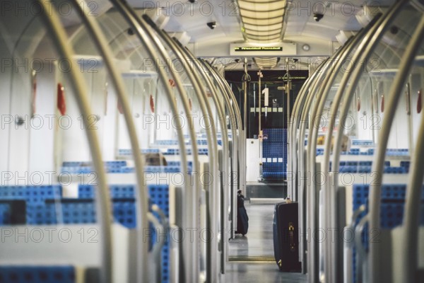 Inside The Wagon Train Germany, Dusseldorf. Empty train interior. interior view of corridor inside passenger trains with blue fabric seats of German railway train system