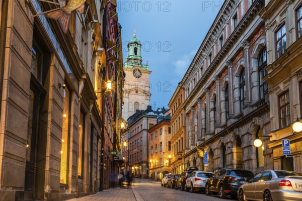 Stockholm, Sweden, August 8, 2019: Scenic view of empty cobblestoned street in Gamla Stan at sunset, the Old Town is one of the largest and best preserved medieval city centers in Europe