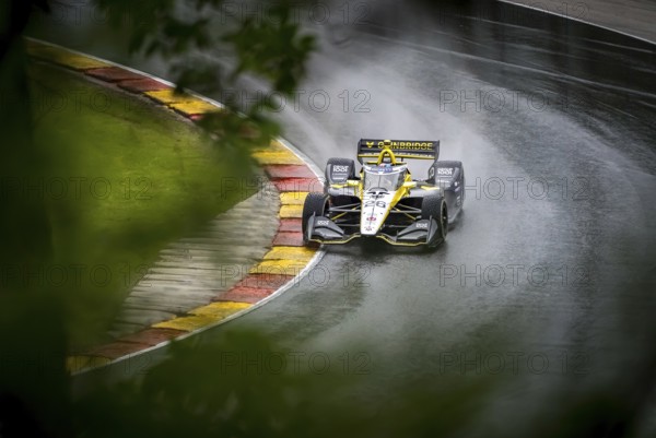 COLTON HERTA (26) of Valencia, California comes through turn 12 (Canada Corner) during a wet practice session for the XPEL Grand Prix at Road America in Elkhart Lake, WI