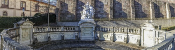 Panoramic photo of the source of the Danube and the Mother Baar figure group in front of the Catholic Church of St. John, Donaueschingen, Southern Black Forest, Black Forest, Baden-Württemberg, Germany