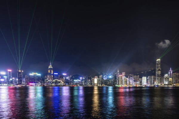 HONG KONG, CHINA - SEPTEMBER 27 2024: Night time Symphony of Light and Sound show in Hong Kong Island and Victoria Harbour from Kowloon on a autumn evening