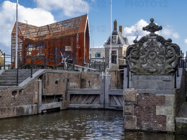 Lock complex with the historic start of the lock next to the modern building Open-air museum Hondsbossche Sluis Zaandam, Zaandam, North Holland, Netherlands