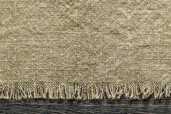 Vintage sacking fabric on wooden board