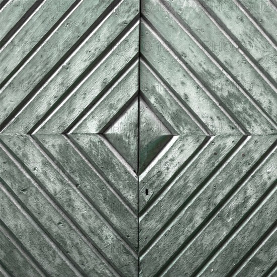 Details of an old wooden door with diamond pattern