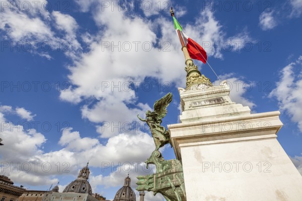 Close up of column of the famous National Monument the Vittoriano or Altare della Patria in Piazza Venezia with italian flag. Rome, Lazio, Italy