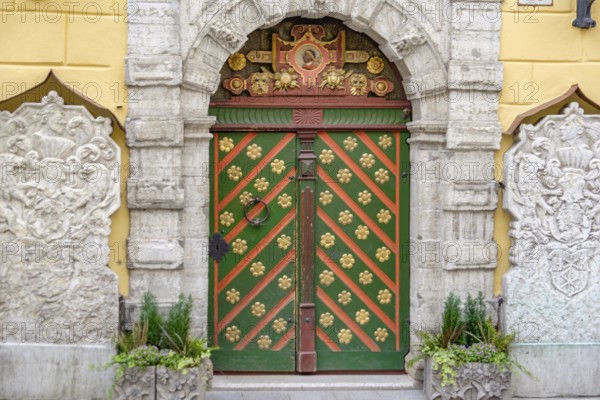 Ornate historic door with detailed stone and colour pattern in an urban setting, tallinn, estonia