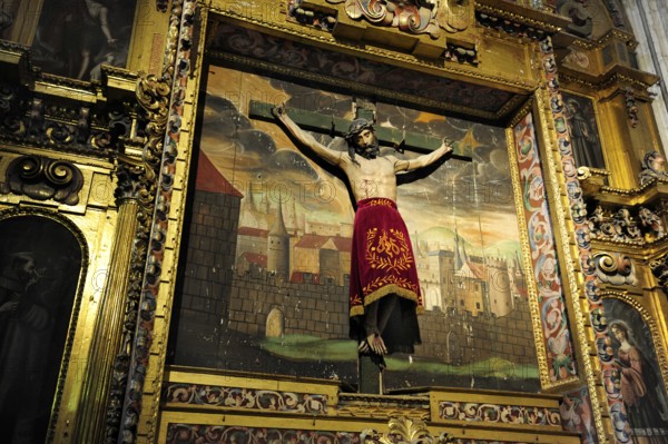 Crucifix in front of a painting in the cathedral, historic city centre, UNESCO World Heritage Site, Segovia, Castilla-Leon, Castilla y Leon, Spain