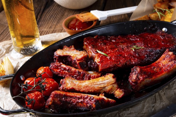 Grilled ribs in a spicy marinade with salad and vegetables