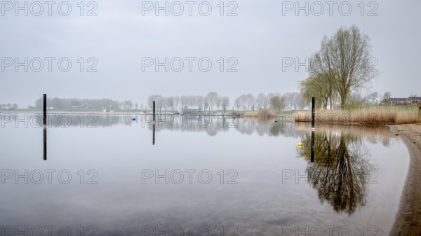 Dutch river landscape. View from the Island of Maurik in Gelderland, Netehralds