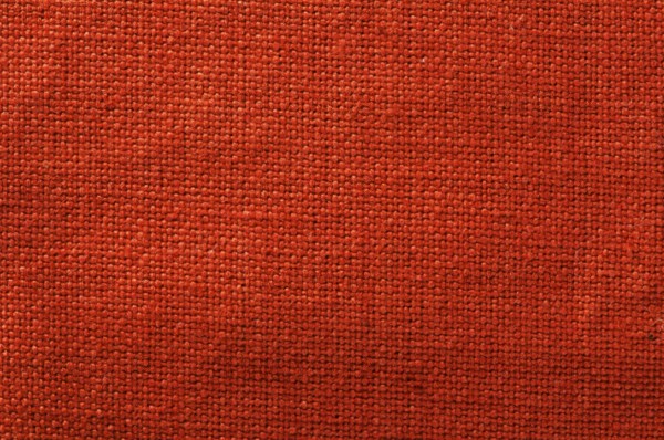 Cotton textile background. Red closeup textile texture