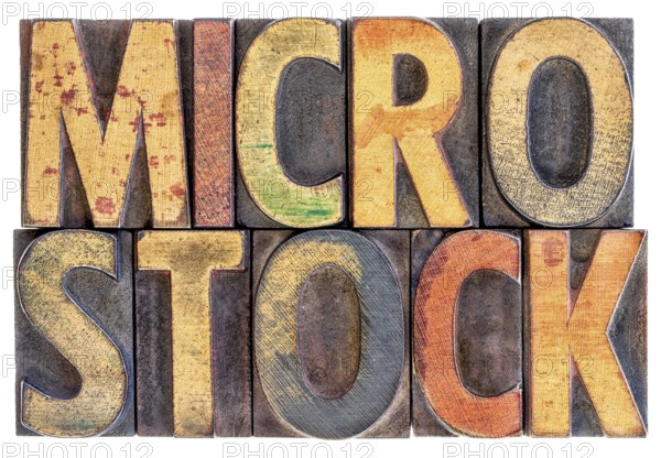Microstock photography concept - isolated word abstract in vintage letterpress wood block type, stained by color ink