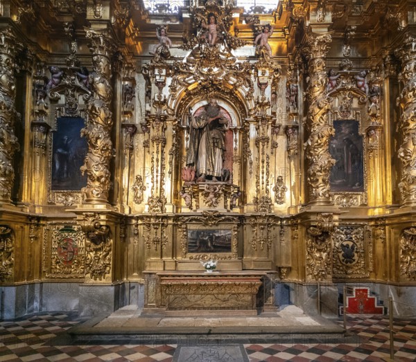 Segovia, Spain, 7 April, 2024: detail view of a gilded altar piece in a side chapel of the Segovia Cathedral