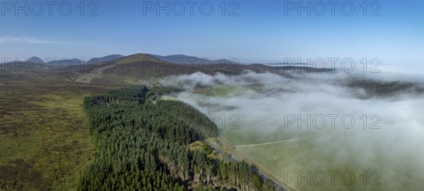 Coastal fog in the Scottish Highlands with hills, in the background prominent peak of Morven, Caithness, drone image, Broch of Ousdale, Berriedale, Scotland, Great Britain