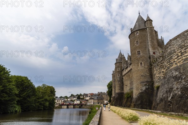 Josselin, France, July 26, 2018: View of the Castle and the river in the medieval town, Brittany