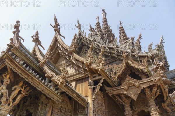 Close-up of an ornately carved wooden temple with lots of detail, Pattaya, Thailand