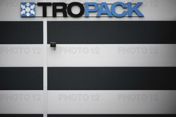 Lahnau, Germany - October 07, 2017: The logo of Tropack, a manufacturer of desiccants and packaging aids, on an industrial building in Lahnau on 07 October 2017