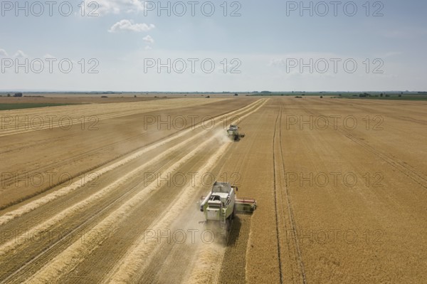 Combine harvester working on a wheat field. Combine harvester Aerial view