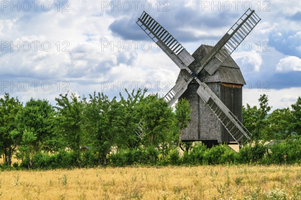 A view of a beautiful windmill in Thuringia Germany in a natural setting and an eye catcher for tourists