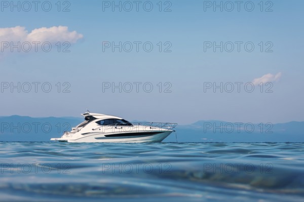 Motor boat floating on clear turquoise water