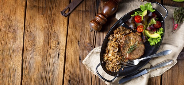 Pork steak with mushrooms and buckwheat groats and mango salad