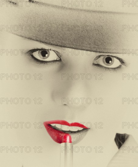 Portrait of a stylish woman with a hat and bright red lips
